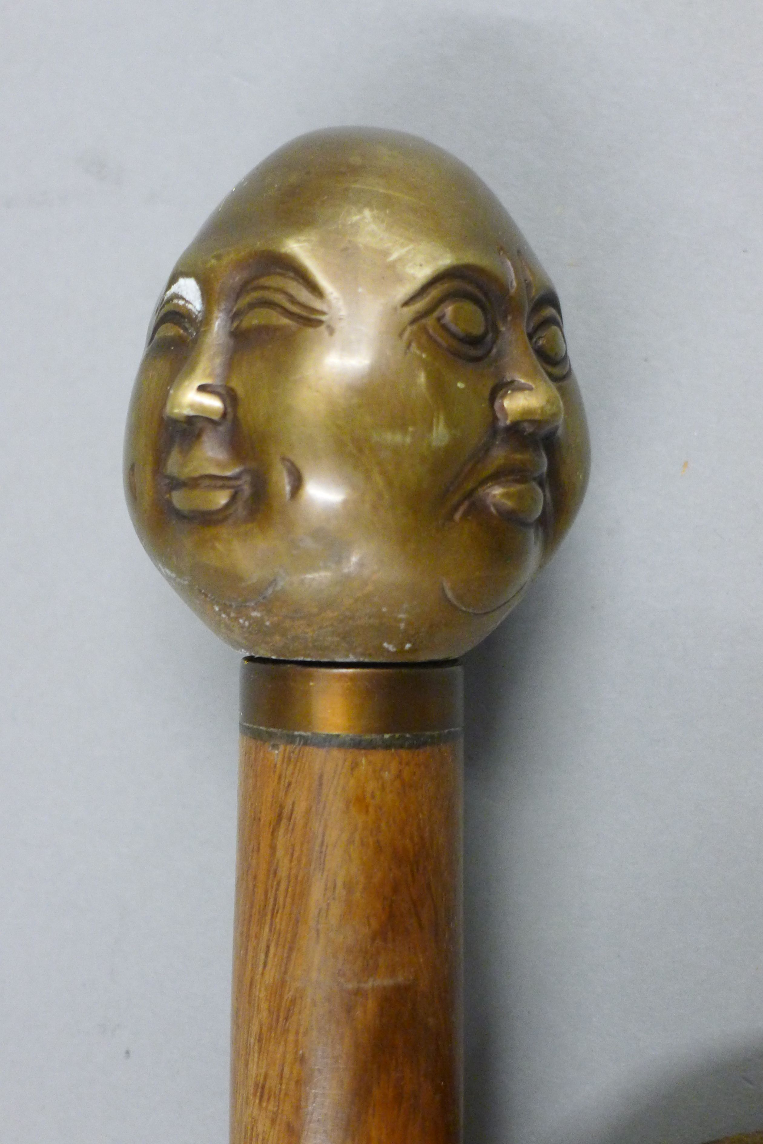 A walking stick with four-faced Buddha handle. 92 cm long. - Image 3 of 3