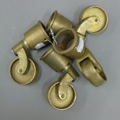 Four brass casters.