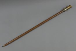 A walking stick mounted with a telescope and compass. 99 cm long.