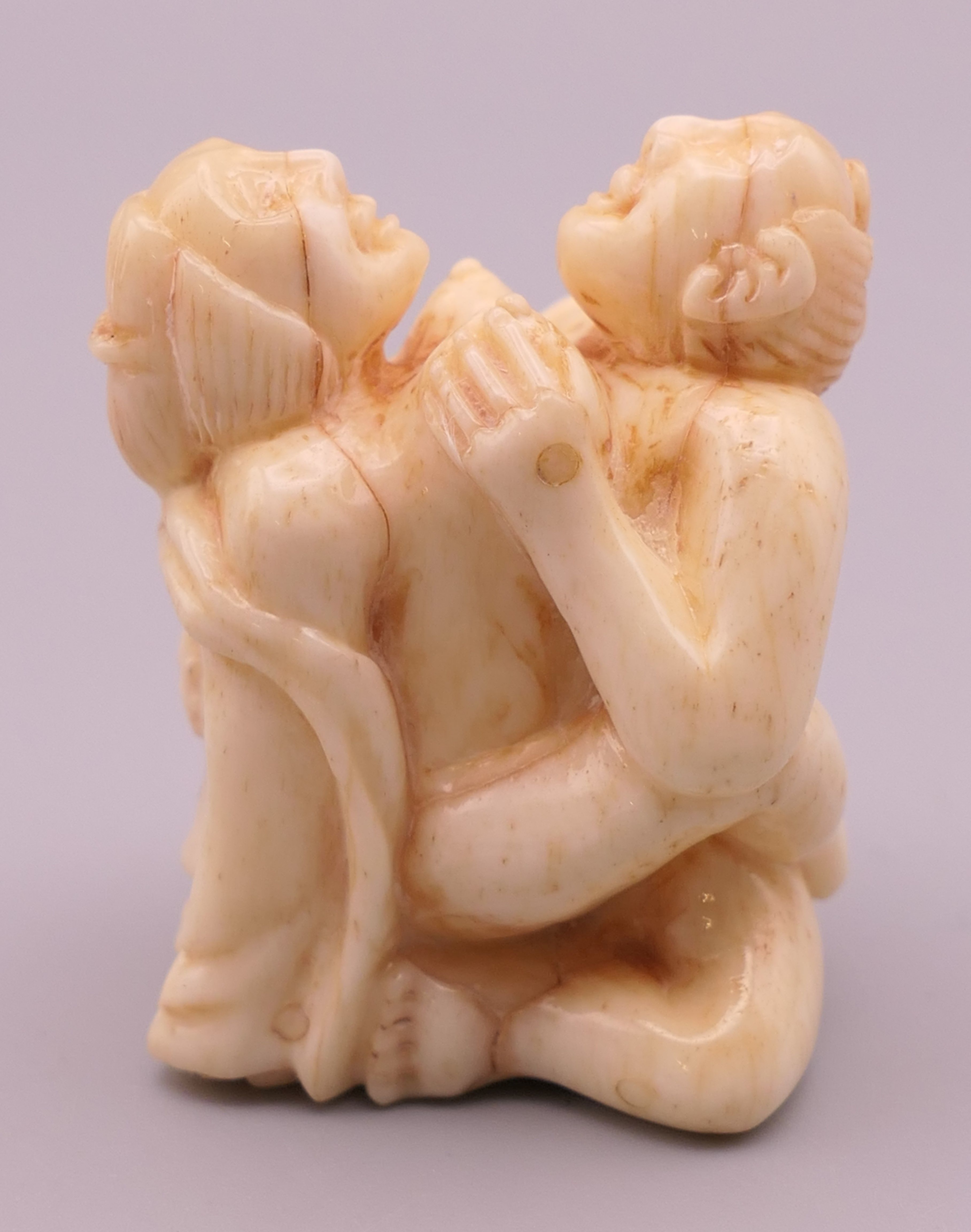 An erotic bone carving. 4 cm high. - Image 2 of 3