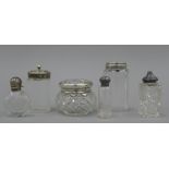 A quantity silver and silver plate topped scent bottles, dressing table jars, etc.