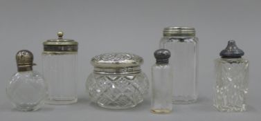 A quantity silver and silver plate topped scent bottles, dressing table jars, etc.