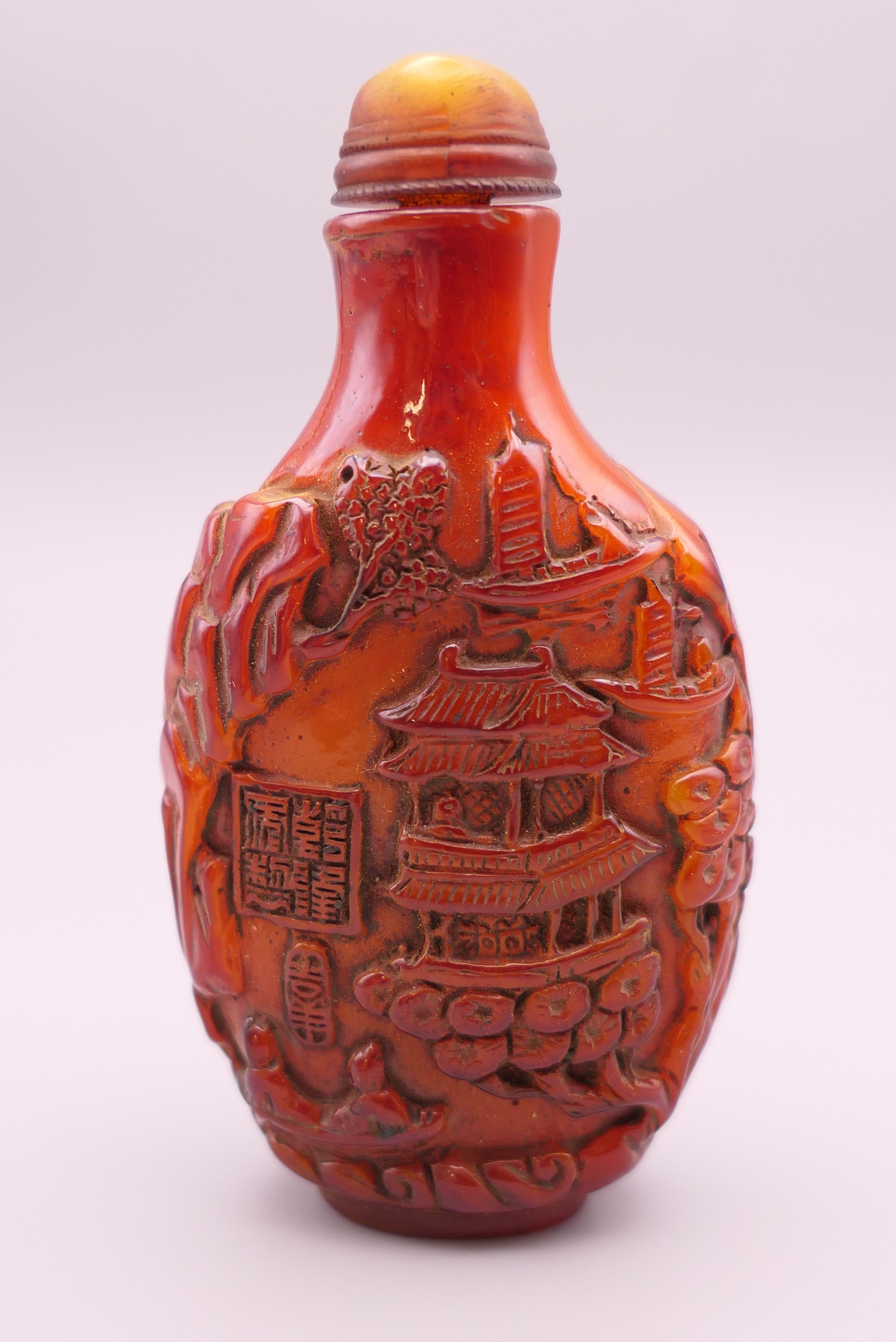 A snuff bottle. 9 cm high.