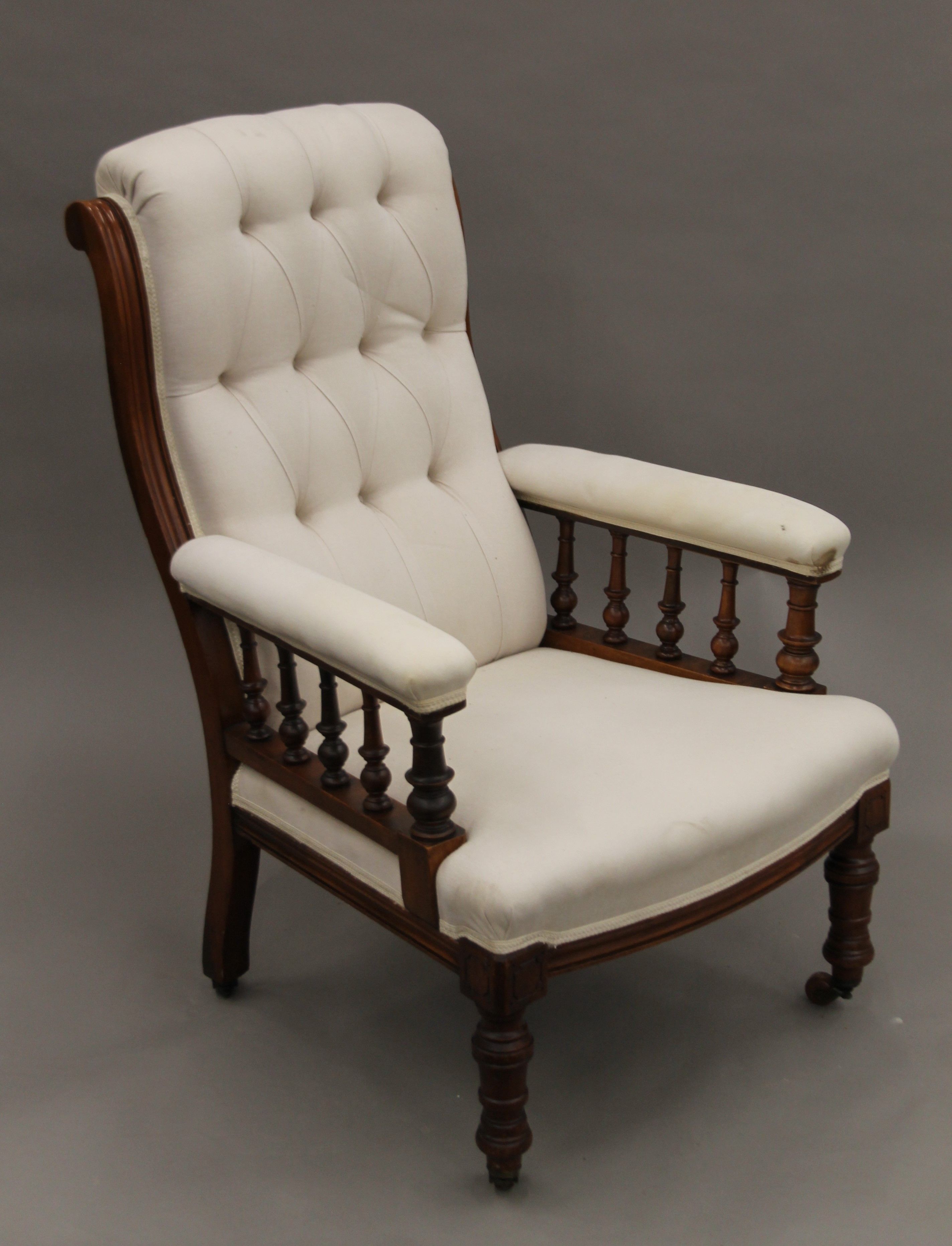 A Victorian upholstered button back walnut open armchair. 69 cm wide. - Image 3 of 5