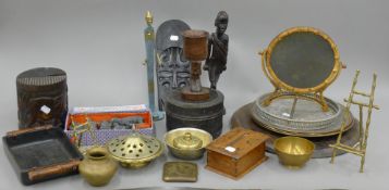 A quantity of various Eastern carvings and metalware.