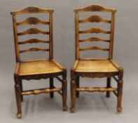 A pair of late 18th/19th century solid seated Country ladder back chairs. 48.5 cm wide.