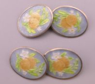 A pair of silver enamel cufflinks. 1.75 cm wide.