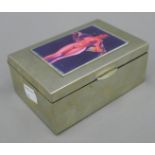 A silver plated cigarette box, the top decorated with a female nude. 13 cm wide.