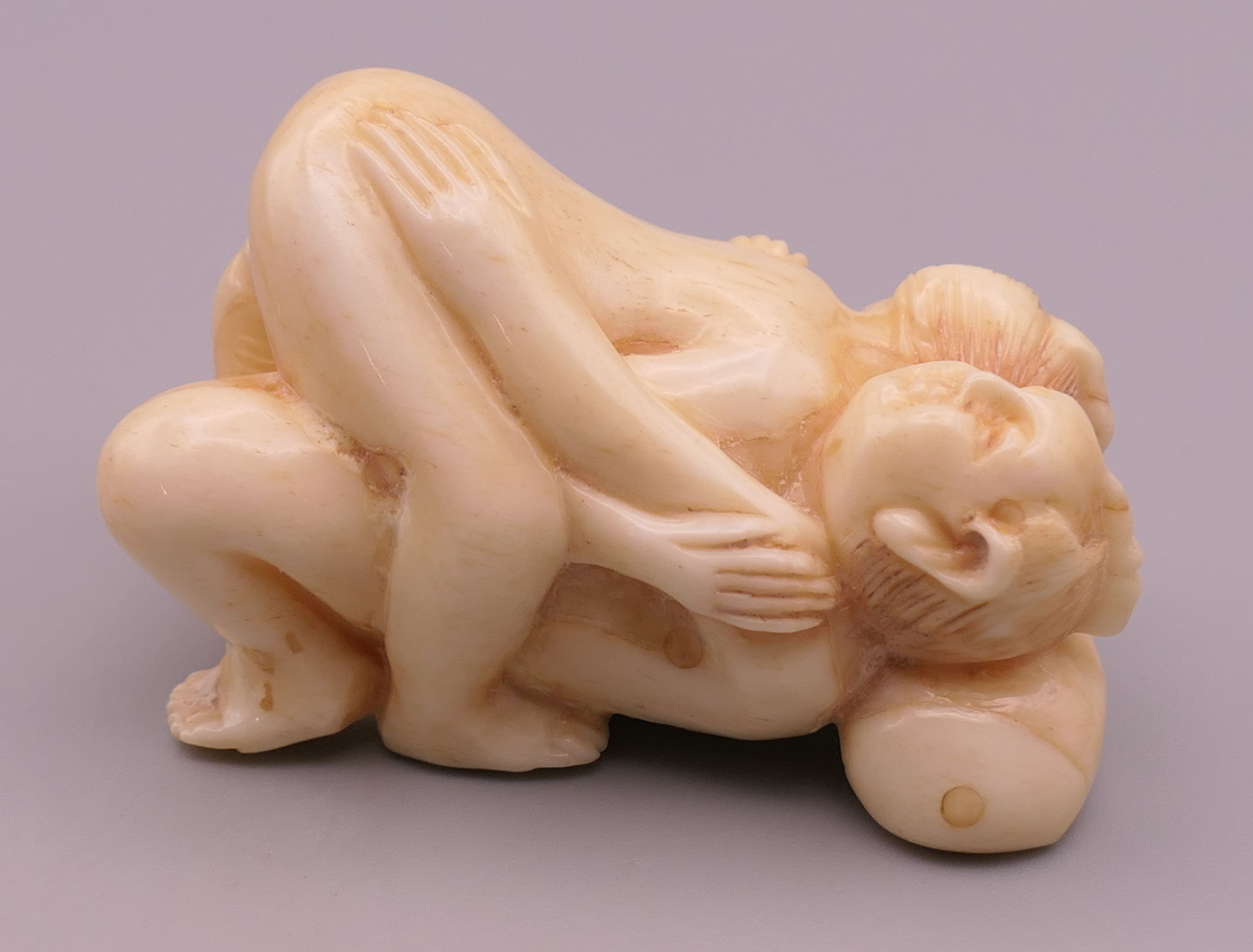 An erotic bone carving. 5 cm long.