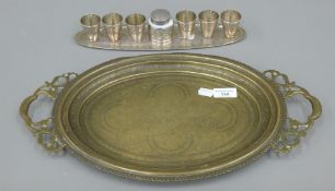 A quantity of Islamic metalware. The largest 48 cm long.