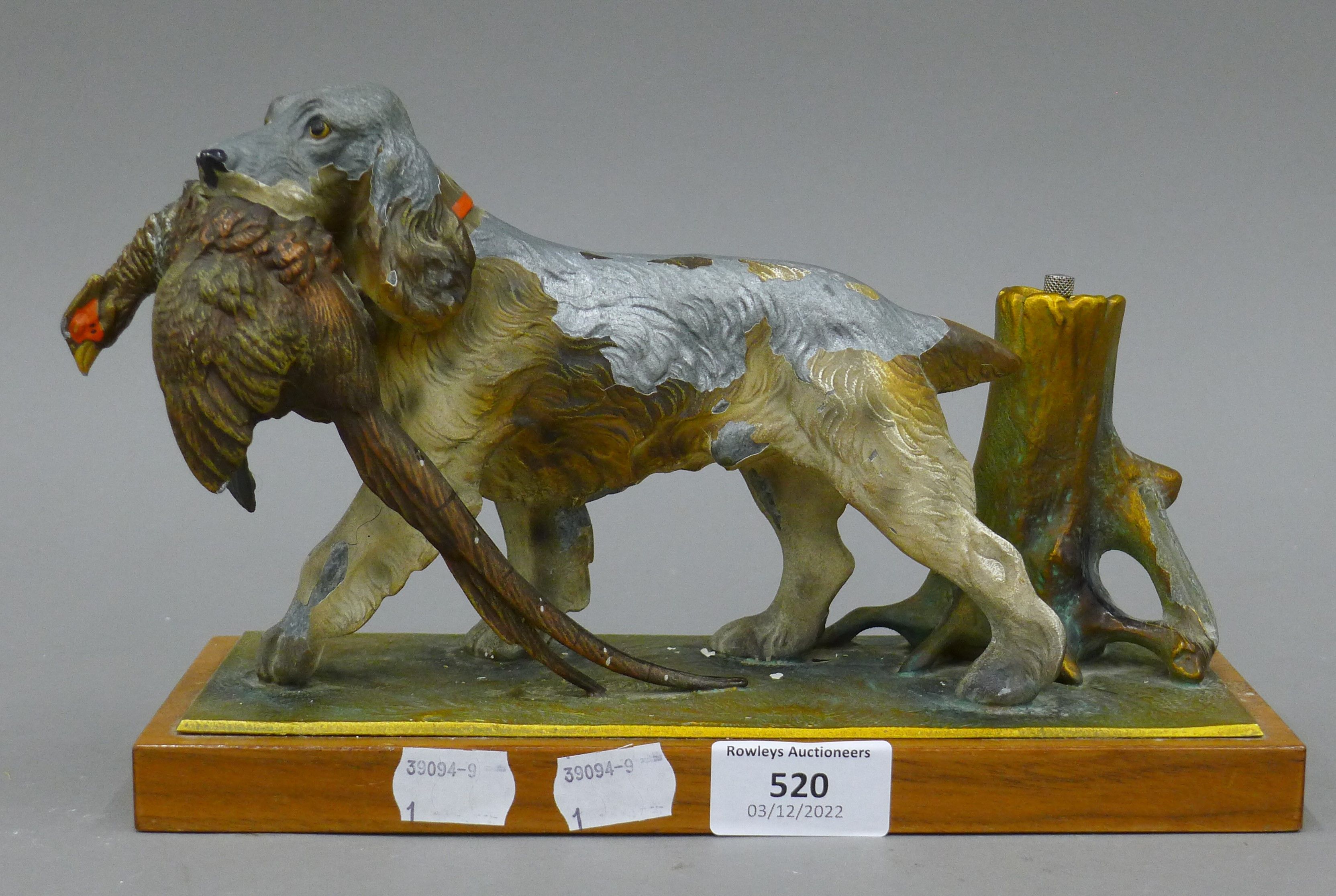A spelter dog and pheasant table lighter. 25 cm long.