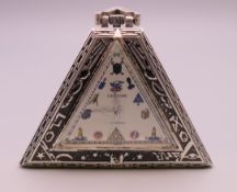 A silver pocket watch in the Masonic style. 5 cm high.