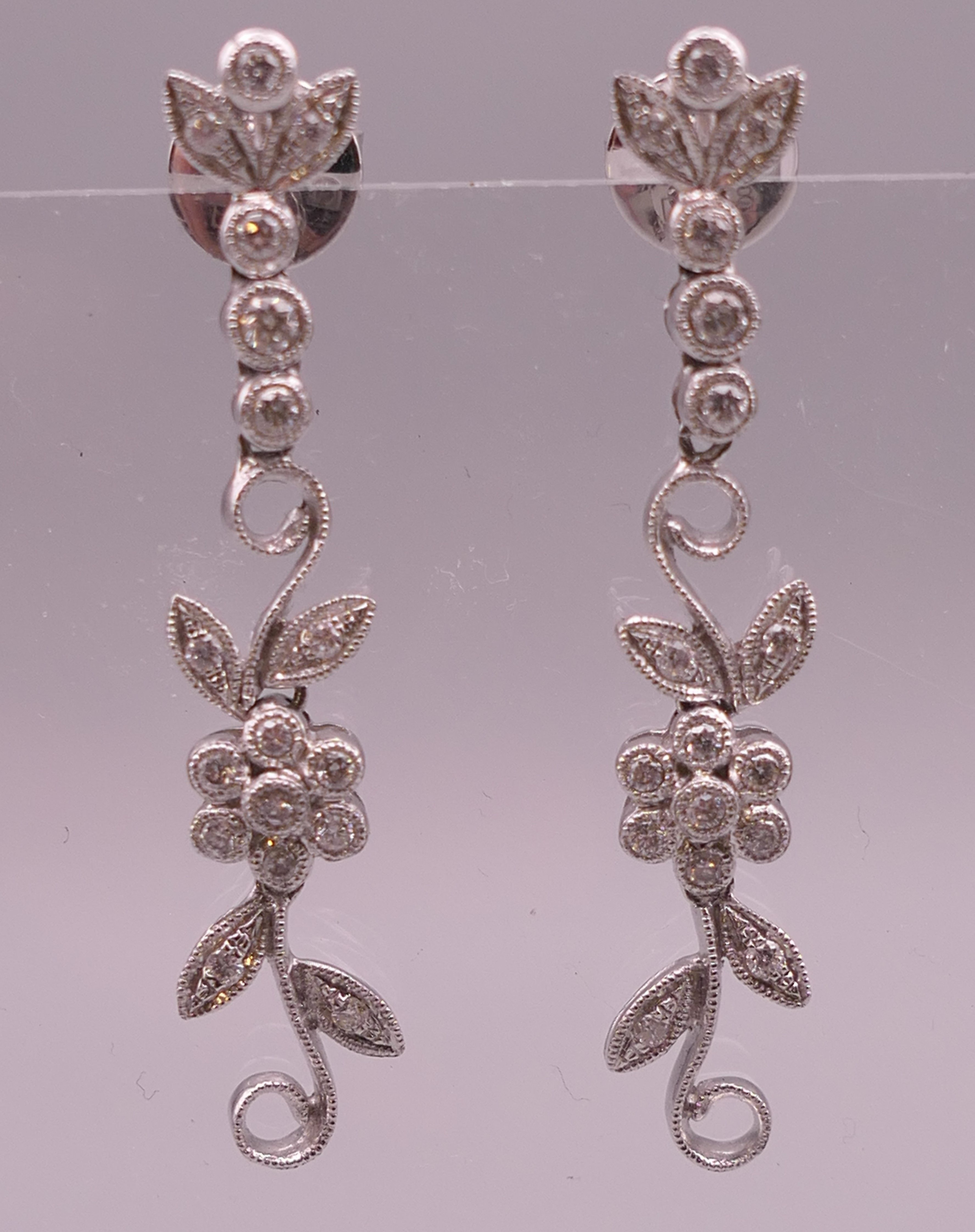 A pair of 18 ct white gold diamond flower drop earrings. Approximately 4 cm long. - Image 4 of 12