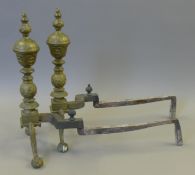 A pair of brass andirons. 49 cm high.