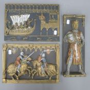 Three plaster plaques depicting various knights, etc. The largest 32 cm wide.