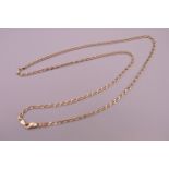 A 9 ct gold chain. 62 cm long. 8.9 grammes.