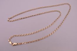 A 9 ct gold chain. 62 cm long. 8.9 grammes.