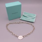 A boxed Tiffany & Co silver necklace. Approximately 42 cm long.