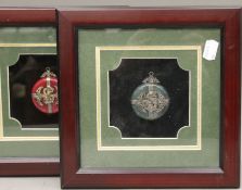 A pair of framed Chinese jade pendants. 24 x 24 cm overall.