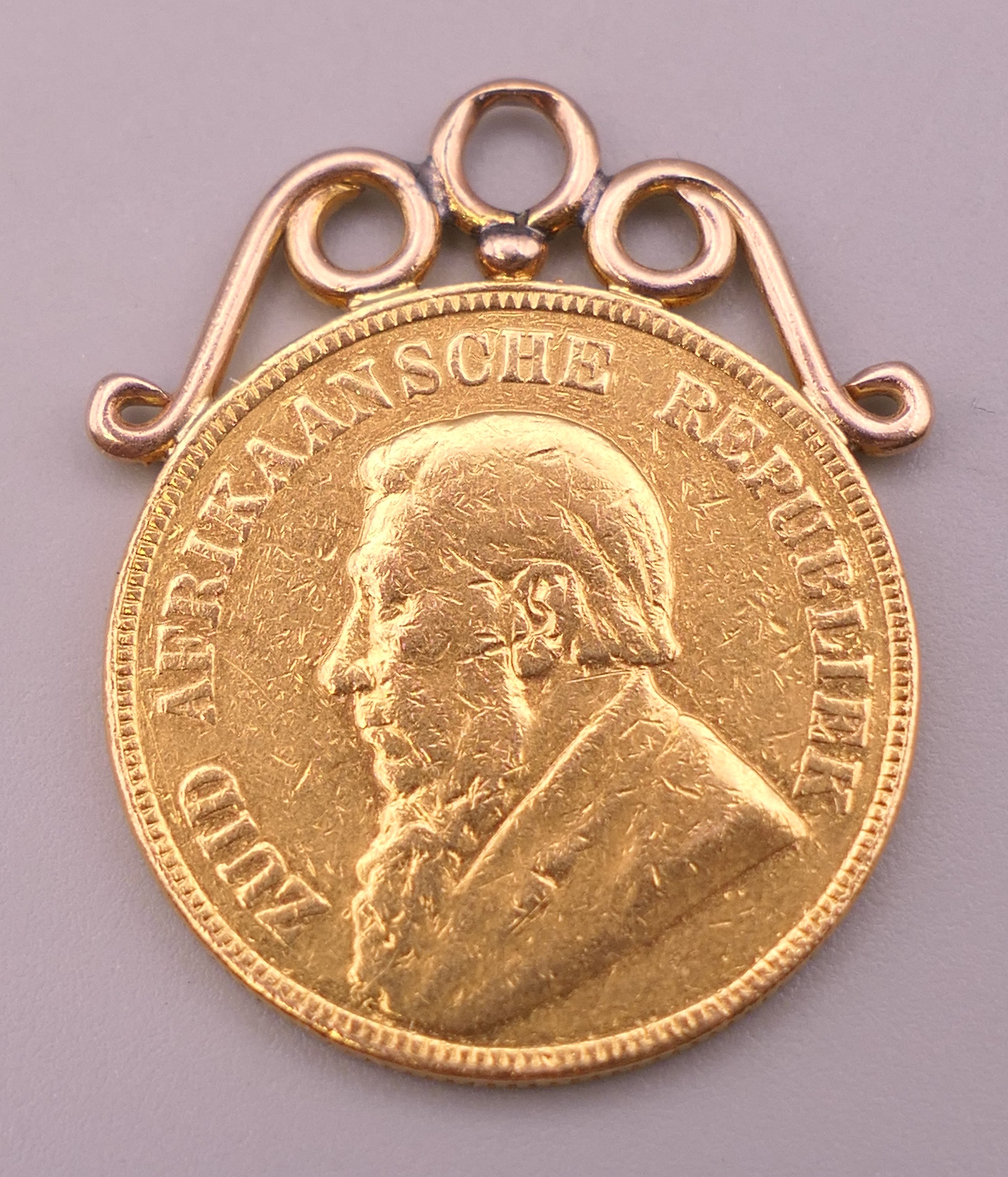 A South African 1898 gold 1 pond coin, with suspension mount. Coin 2 cm diameter. 8.