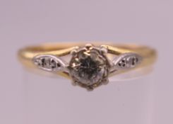 An 18 ct gold and platinum diamond solitaire ring. Ring size Q/R. 2.8 grammes total weight.