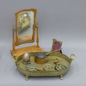 A box of brassware and a Victorian mirror.