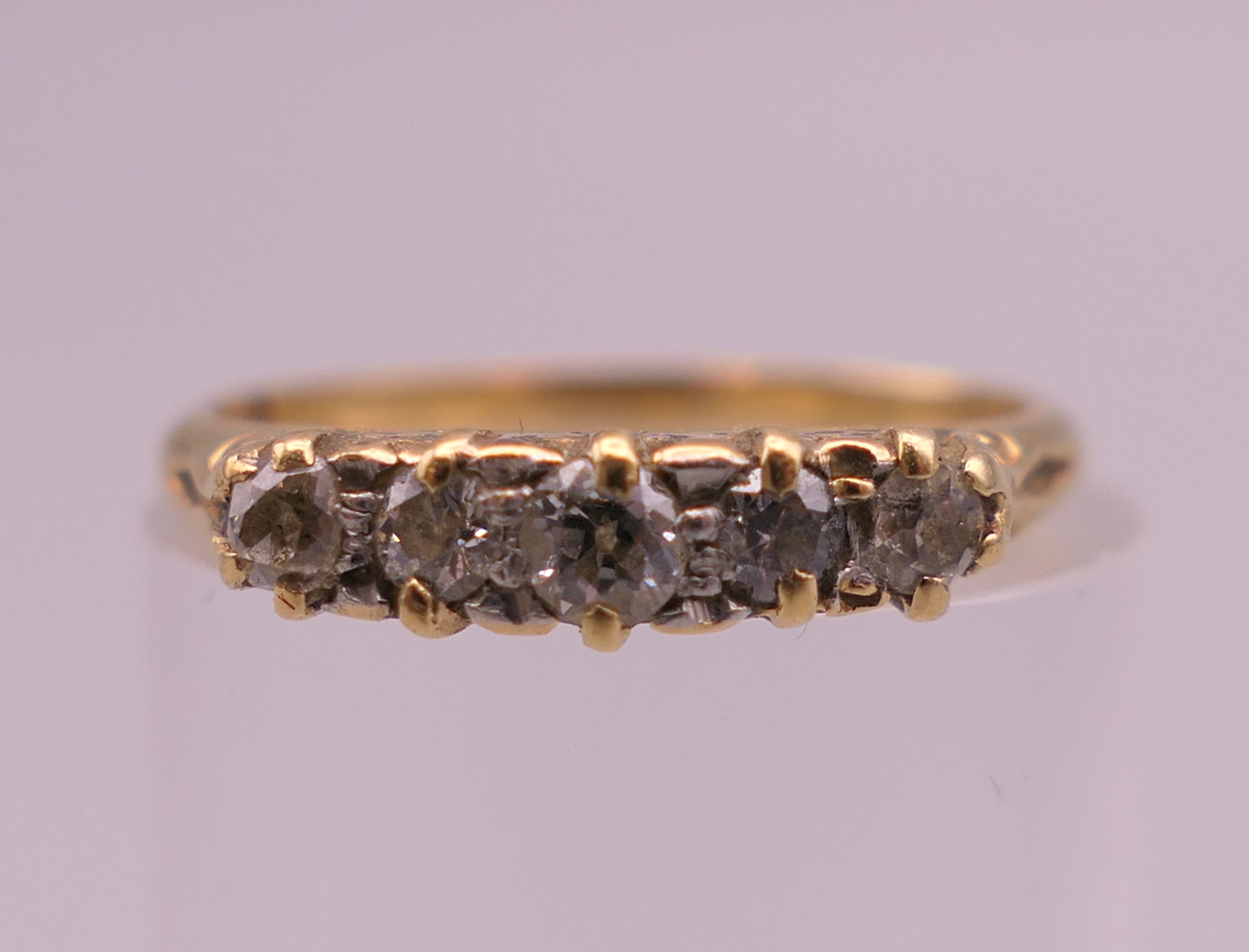 An 18 ct gold five stone diamond ring. Ring size I/J. 1.9 grammes total weight. - Image 2 of 6