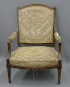 A 19th century French upholstered armchair. 76 cm wide.