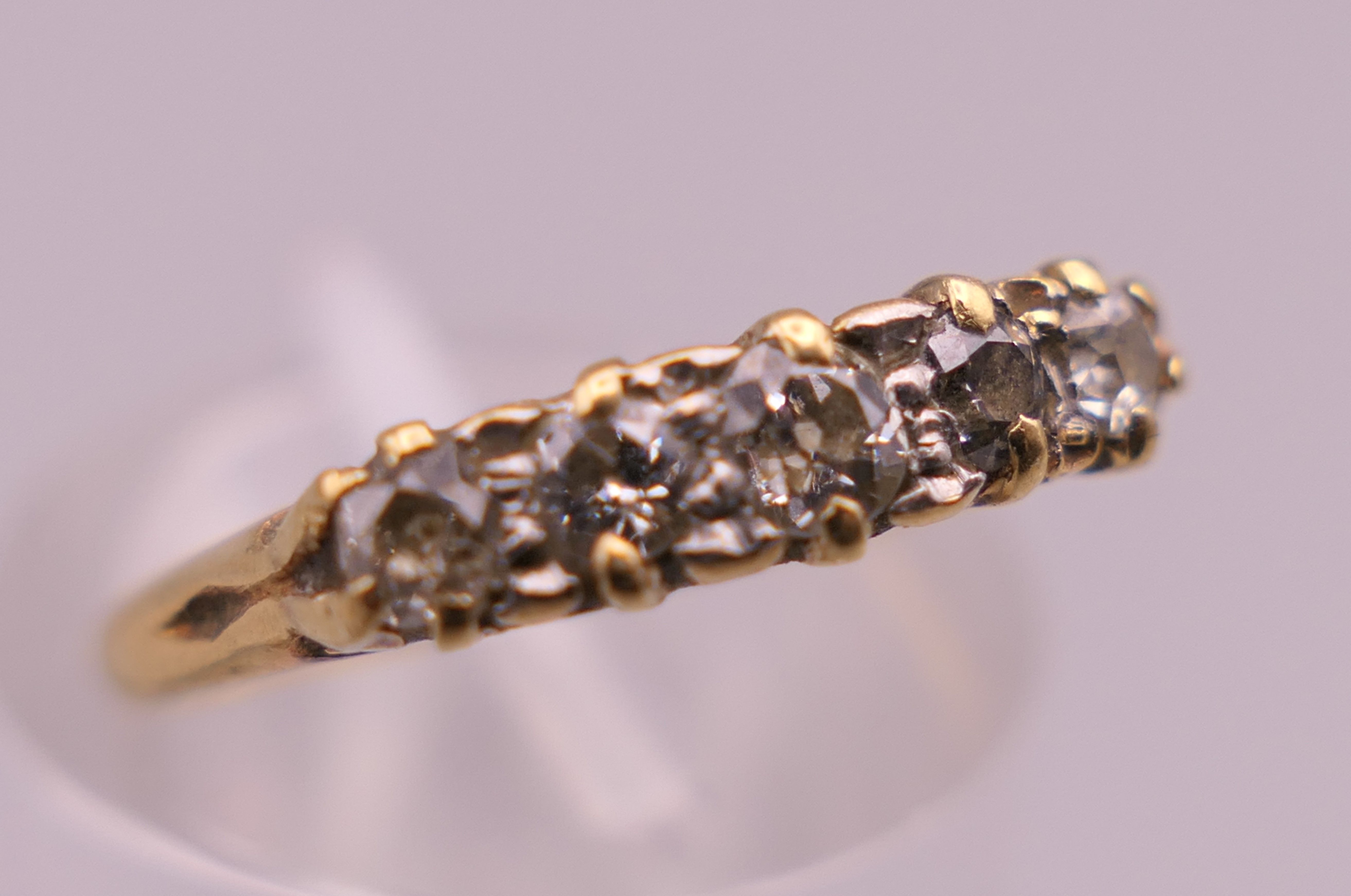 An 18 ct gold five stone diamond ring. Ring size I/J. 1.9 grammes total weight. - Image 6 of 6