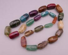 A multi-coloured bead necklace.