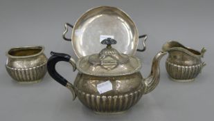 A silver tazza (the foot and handles possibly silver plated) and a plated tea set. The former 22.