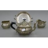 A silver tazza (the foot and handles possibly silver plated) and a plated tea set. The former 22.