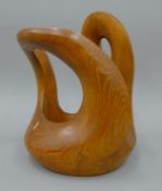 An abstract wooden sculpture. 33 cm high.