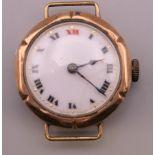 A gold cased wristwatch. 13.1 grammes total weight.