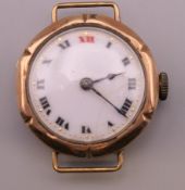 A gold cased wristwatch. 13.1 grammes total weight.