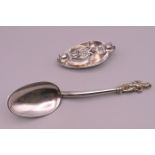 Two Continental silver cutlery items: two spoons folding into each other and a Continental silver