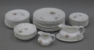 A Royal Doulton Tumbling Leaves dinner service.