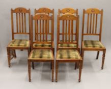 A set of six early 20th century walnut dining chairs.