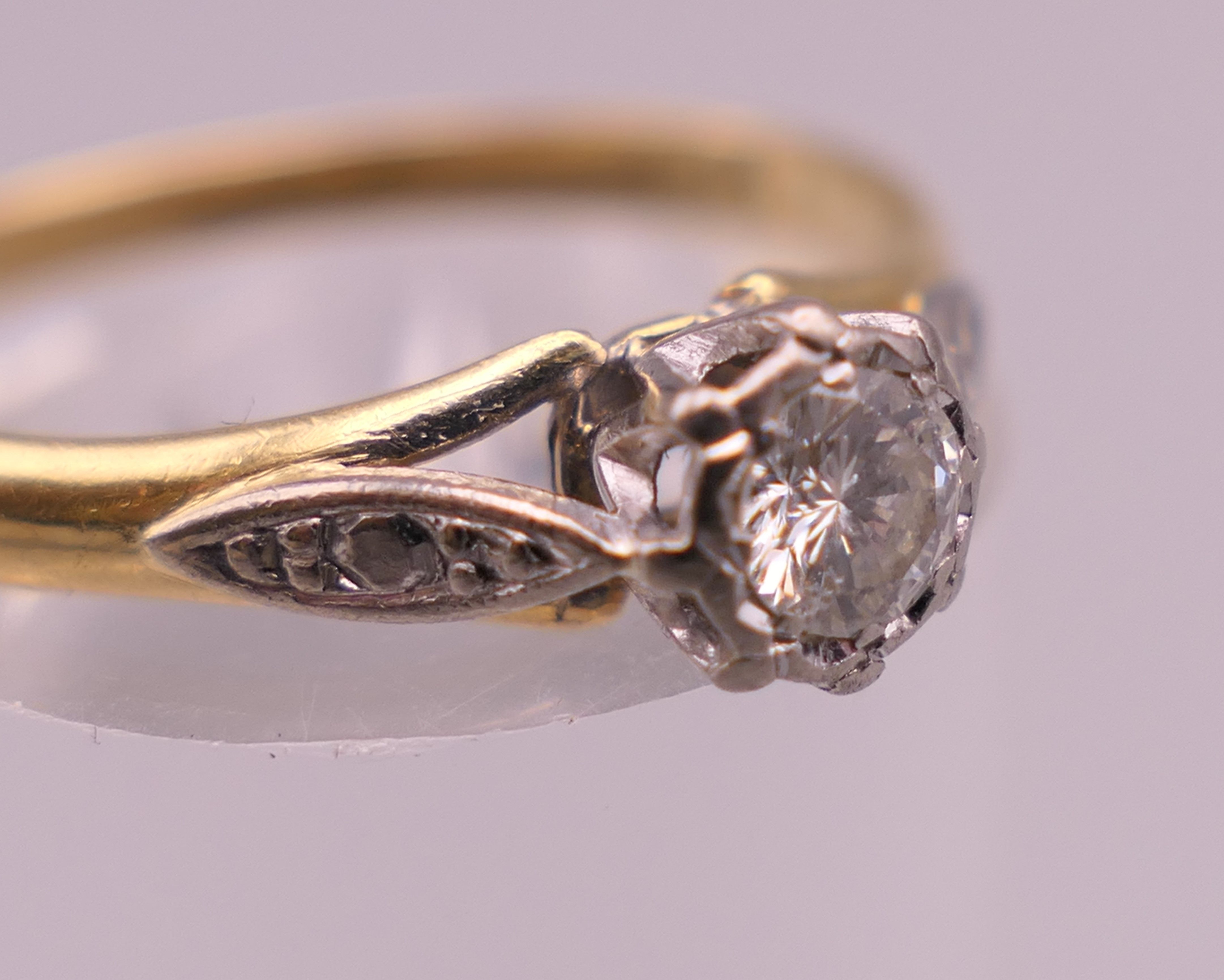 An 18 ct gold and platinum diamond solitaire ring. Ring size Q/R. 2.8 grammes total weight. - Image 5 of 5