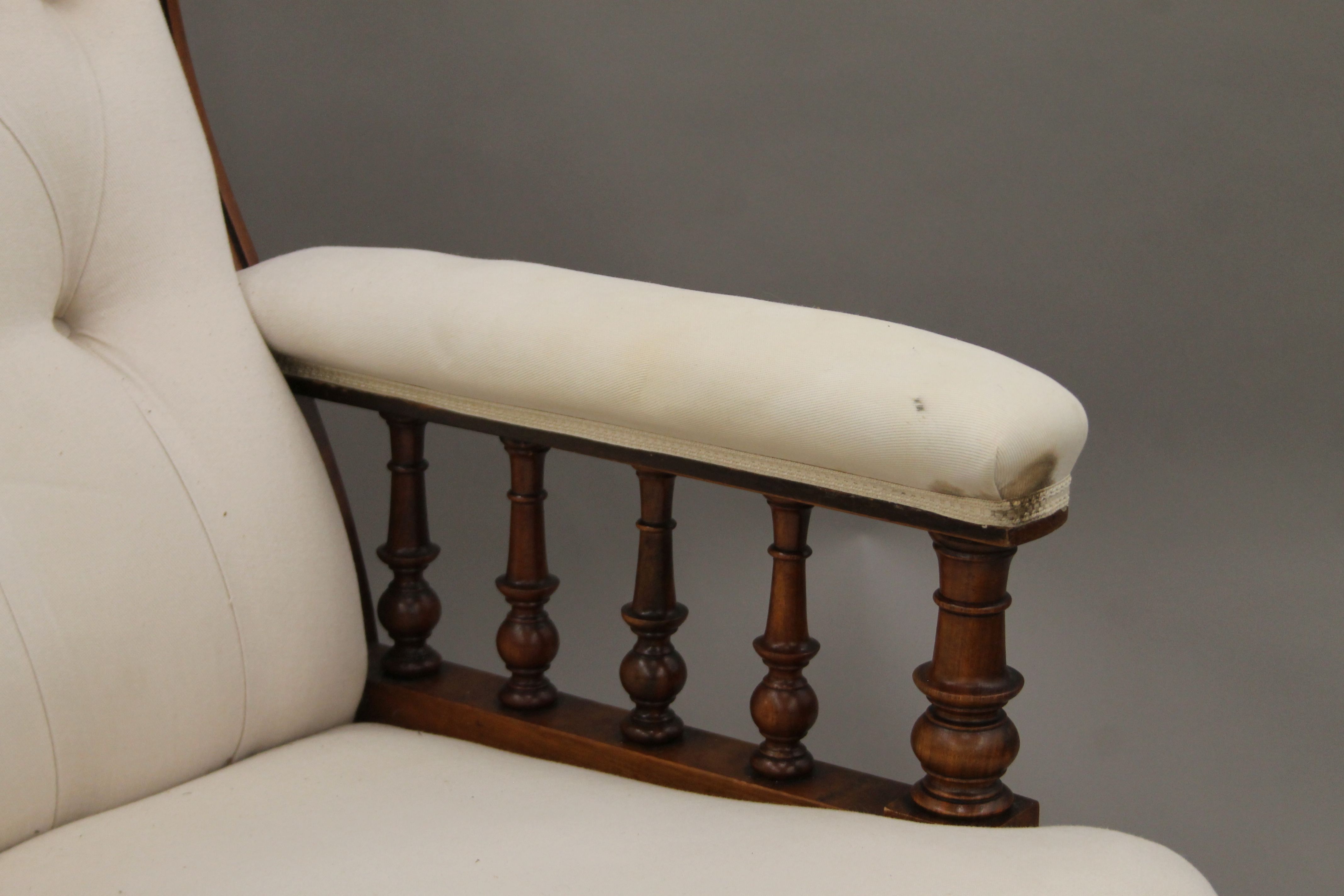 A Victorian upholstered button back walnut open armchair. 69 cm wide. - Image 4 of 5