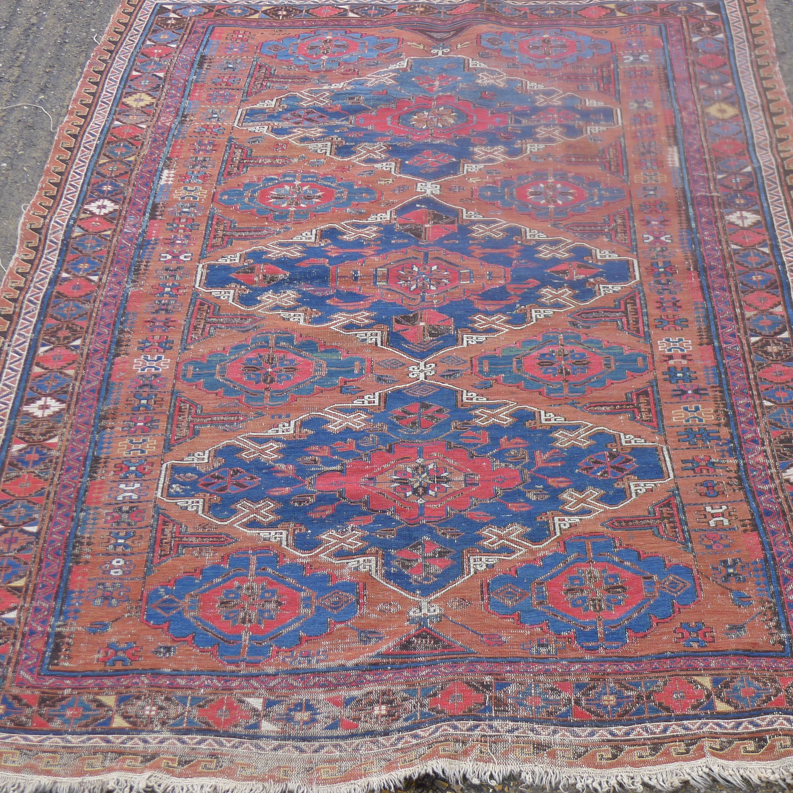A Sumak Kilim red ground rug. 170 x 124 cm.