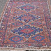 A Sumak Kilim red ground rug. 170 x 124 cm.