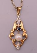 An 18 ct Swedish gold, pearl, sapphire and white stone pendant on a 9 ct gold chain.