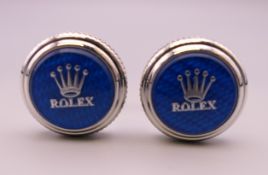 A pair of Rolex cufflinks in a Penrose of London box. 2 cm diameter.