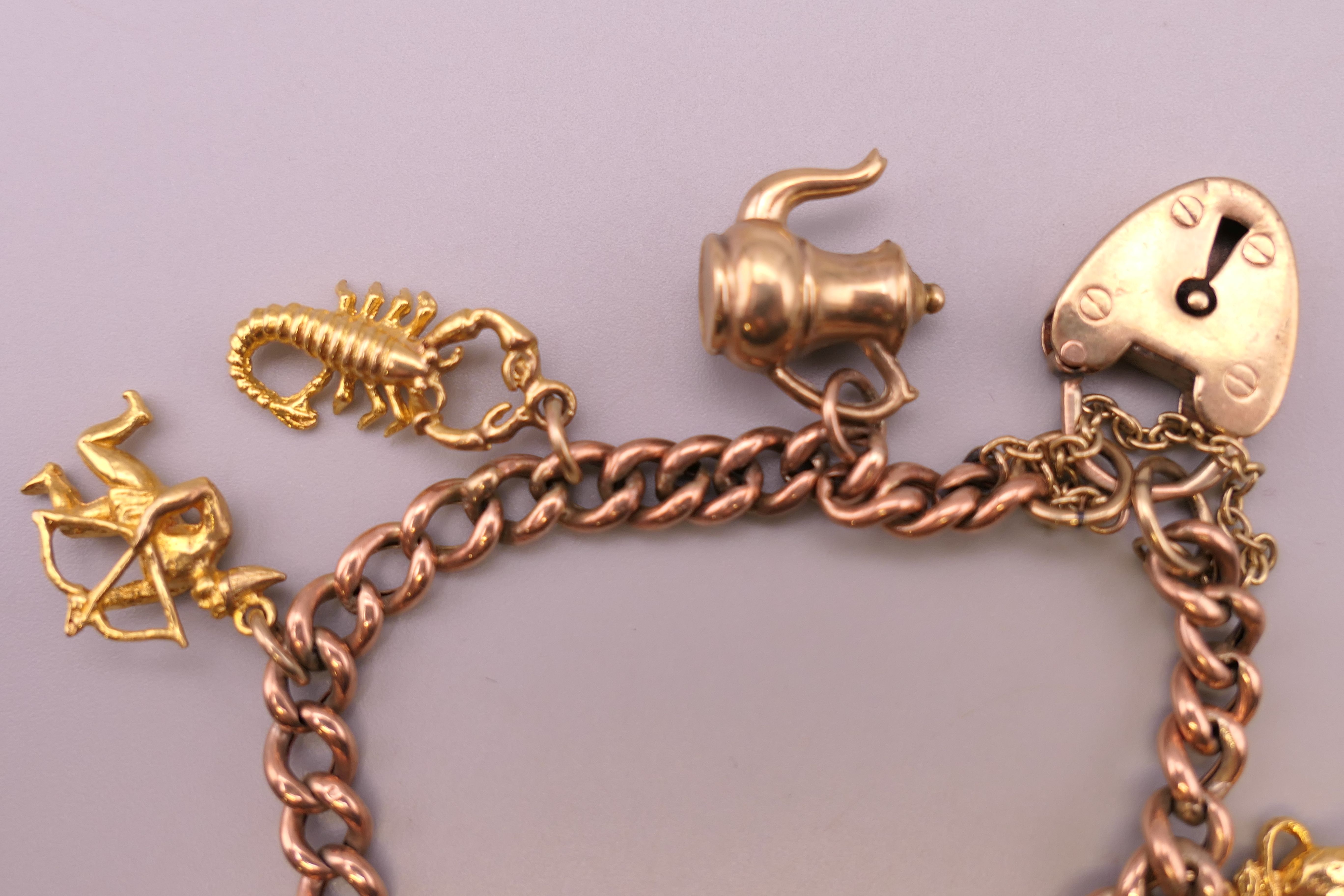 A 9 ct gold charm bracelet. Approximately 14 cm long. 18.4 grammes. - Image 3 of 4