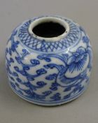 A Chinese blue and white porcelain brush washer and two Chinese porcelain tea bowls.