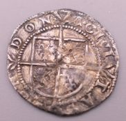 An antique silver coin. 1.6 cm diameter.