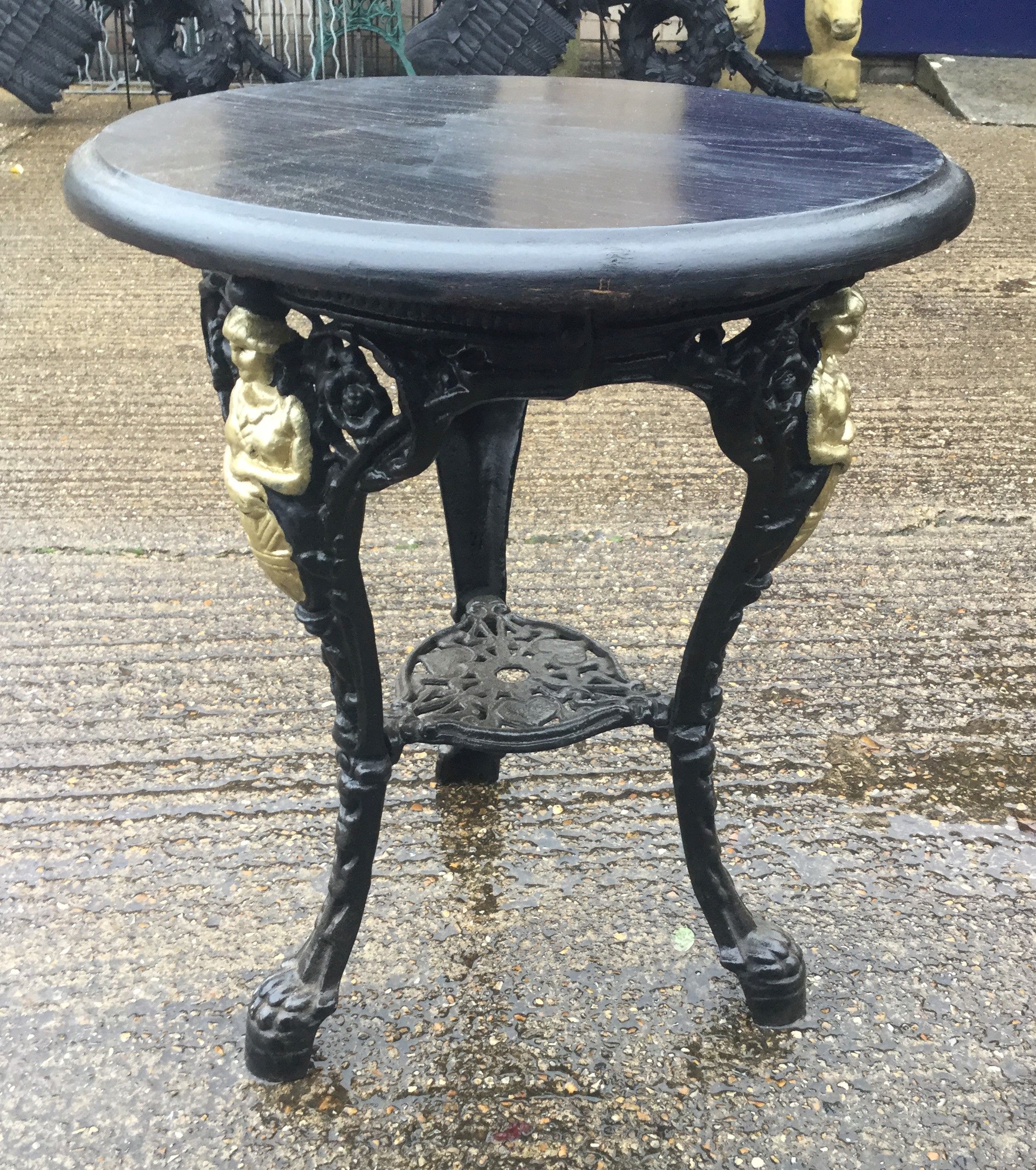 A wooden topped cast iron pub table. 59 cm diameter. - Image 2 of 3