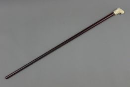 A bone handled walking stick, the handle formed as a male bust. 91.5 cm long.