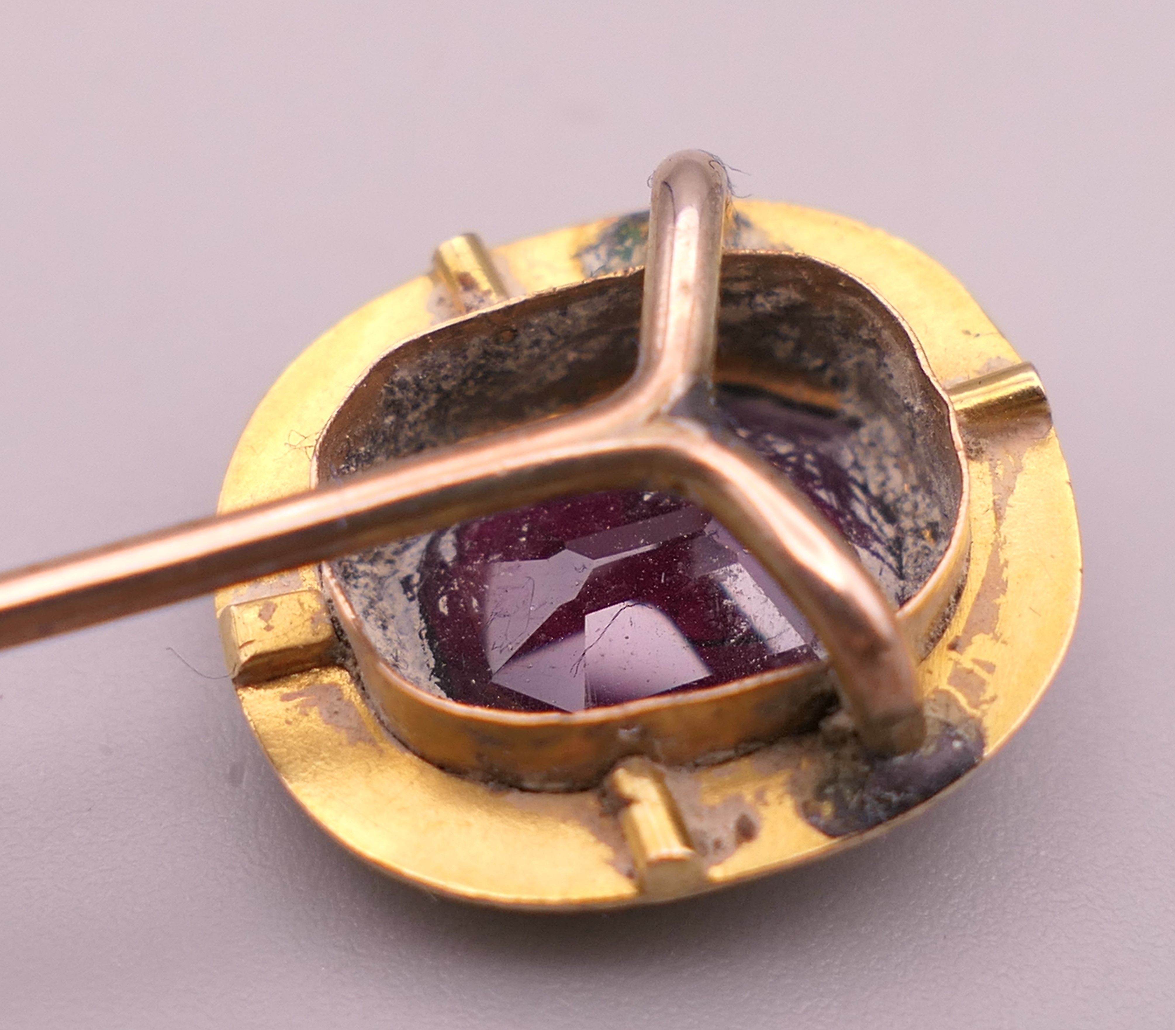 An antique unmarked gold purple stone stickpin, possibly garnet, boxed. 8 cm high. 3. - Image 3 of 6